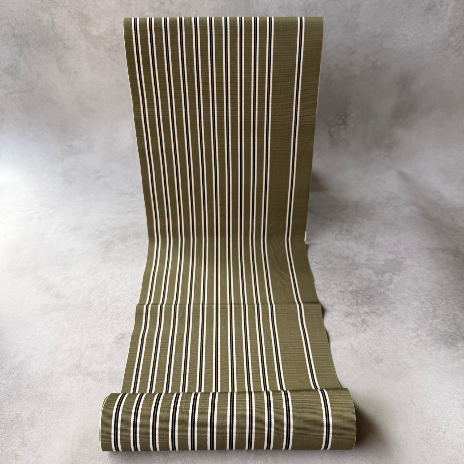 Pre-owned Japanese olive green striped obi fabric bolt shown unrolled